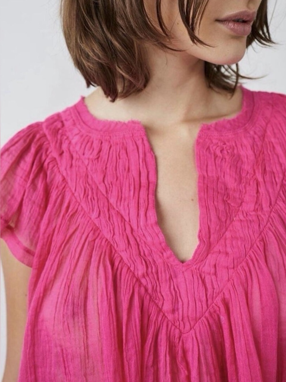Free People FP One Padma
Blouse V Neck Flutter Sleeve
Gauze Raw Trim